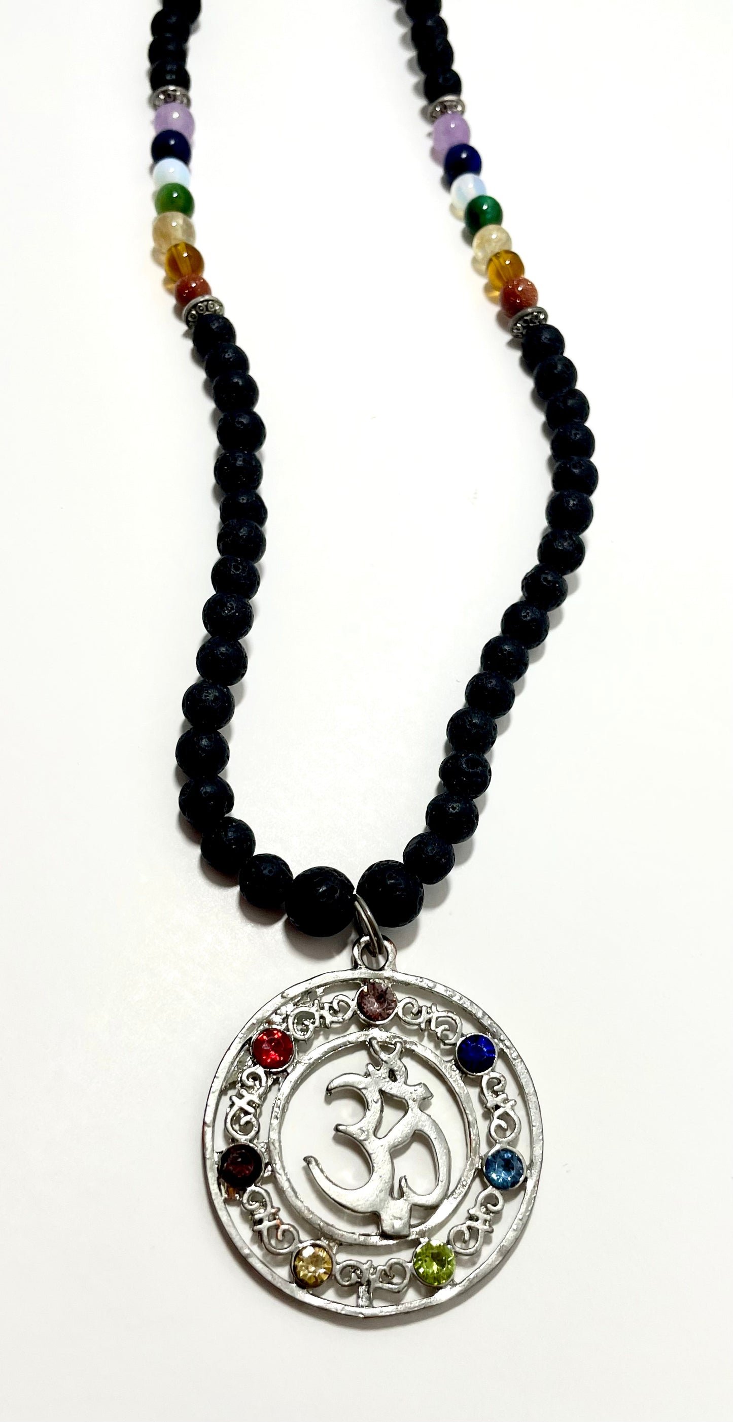 23.5” Stainless Steele Om Chakra Diffuser Necklace Adorned With 6mm Lava Stone Diffuser Beads & Chakra Stones (Amethyst, Lapis Lazuli, Opalite, Green Tigers Eye, Citrine, Amber, & Goldstone)