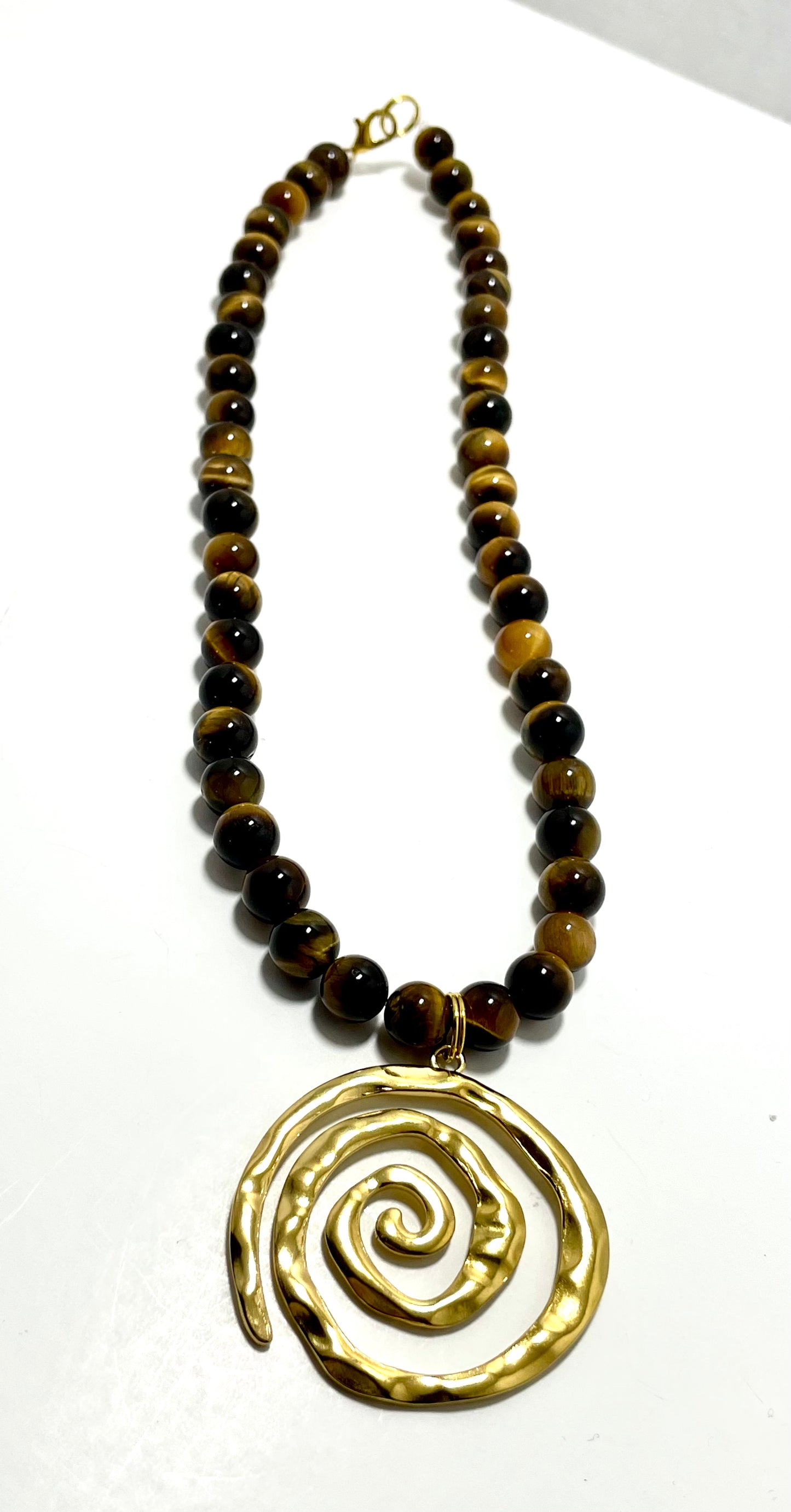 16” Gold Coated Stainless Steel Swirl Necklace Adorned With 8mm Tigers Eye Beads