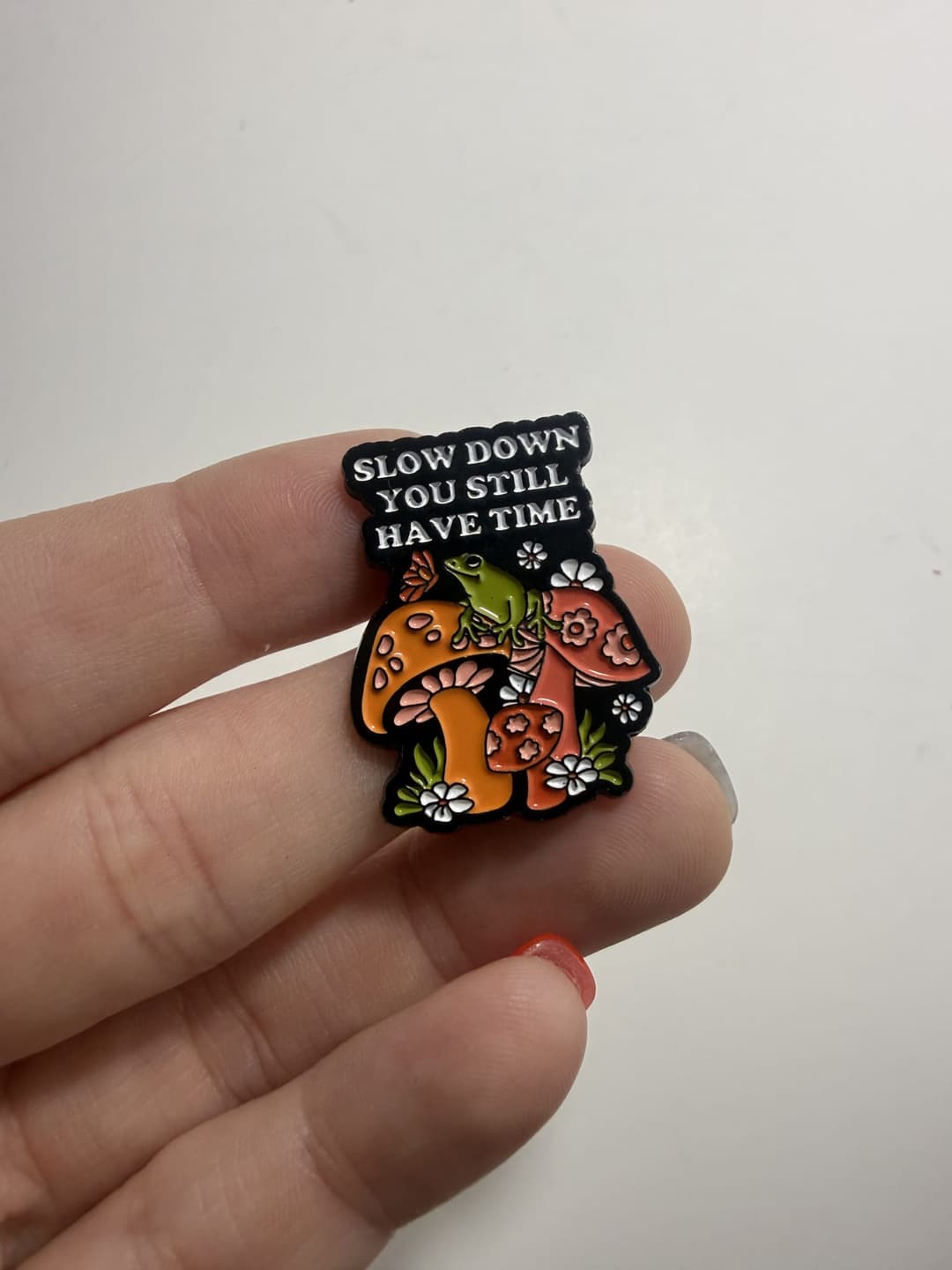 "Slow Down, You Still Have Time" Mushroom Garden Enamel Pin — photo 1