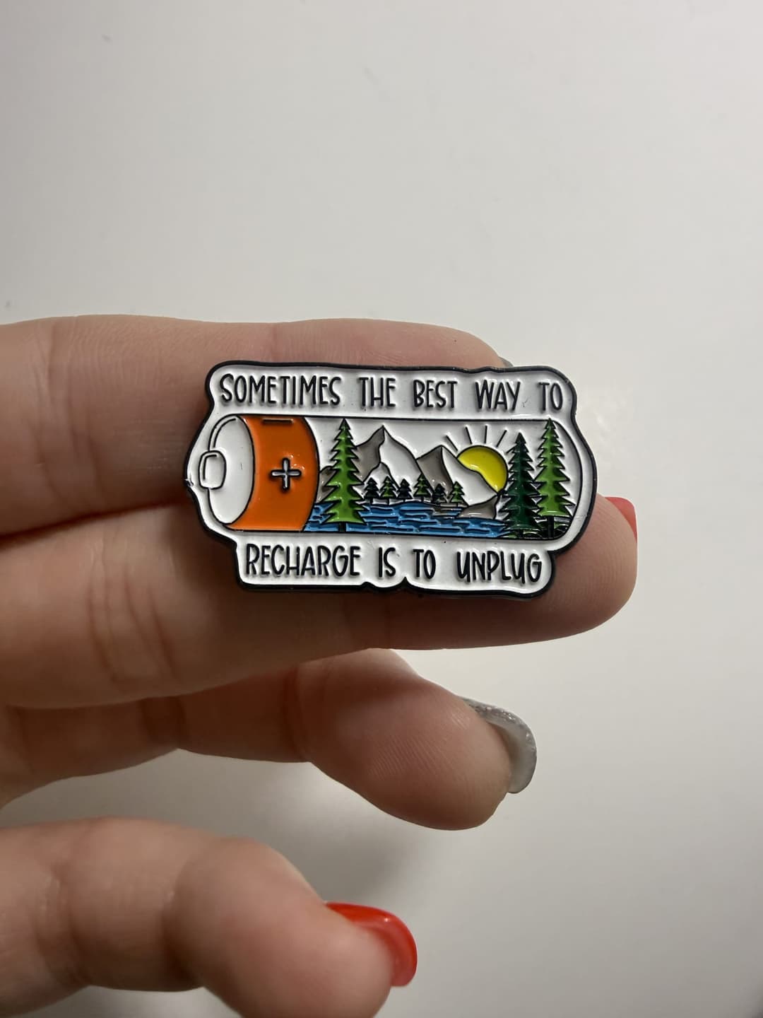 "Sometimes the Best Way to Recharge Is to Unplug" Battery Enamel Pin — photo 1