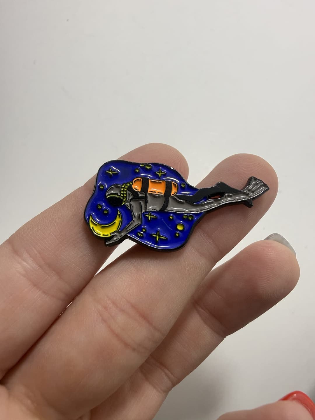 Scuba Diver Holding the Moon Enamel Pin — photo 1