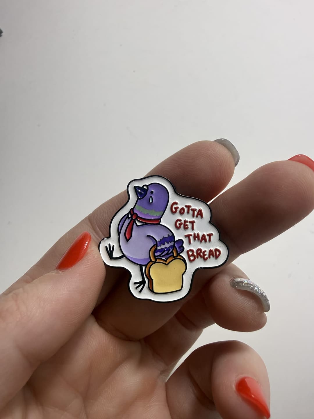 "Gotta Get That Bread" Pigeon Enamel Pin — photo 1
