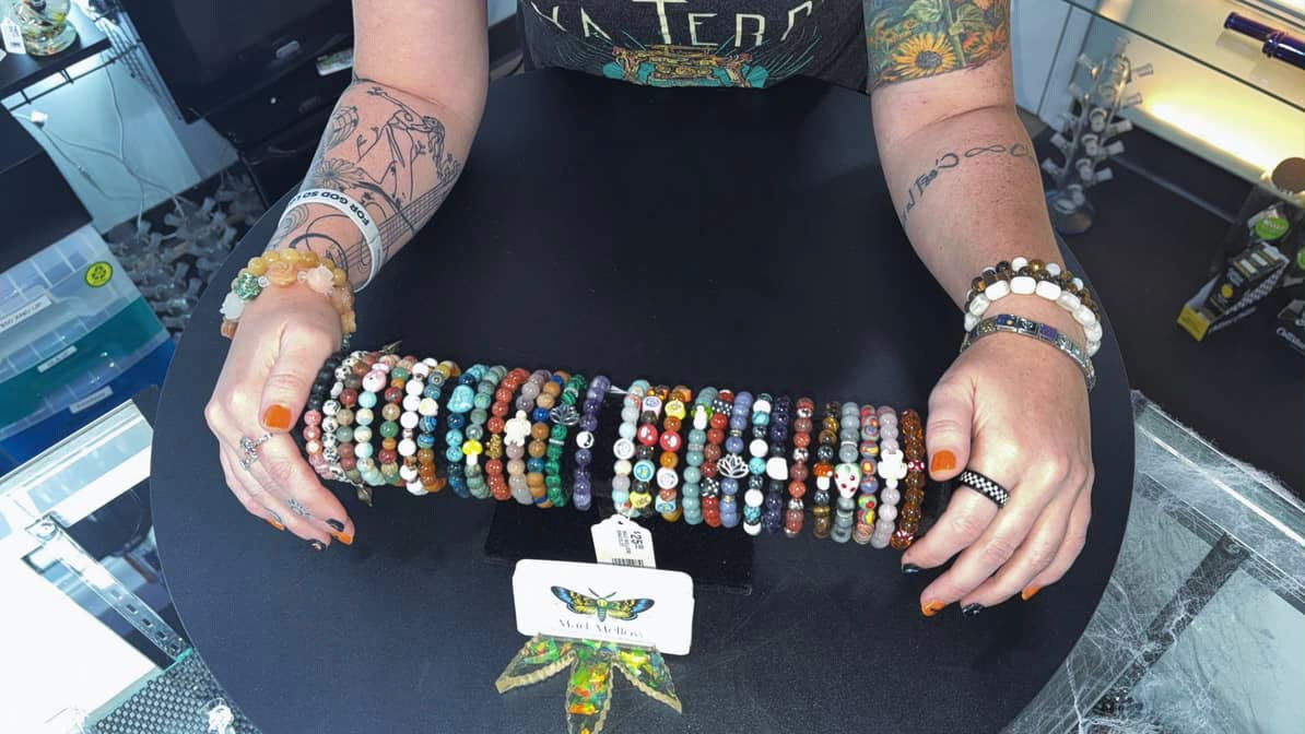 Handmade beaded bracelets on a Mad Mellow display bar