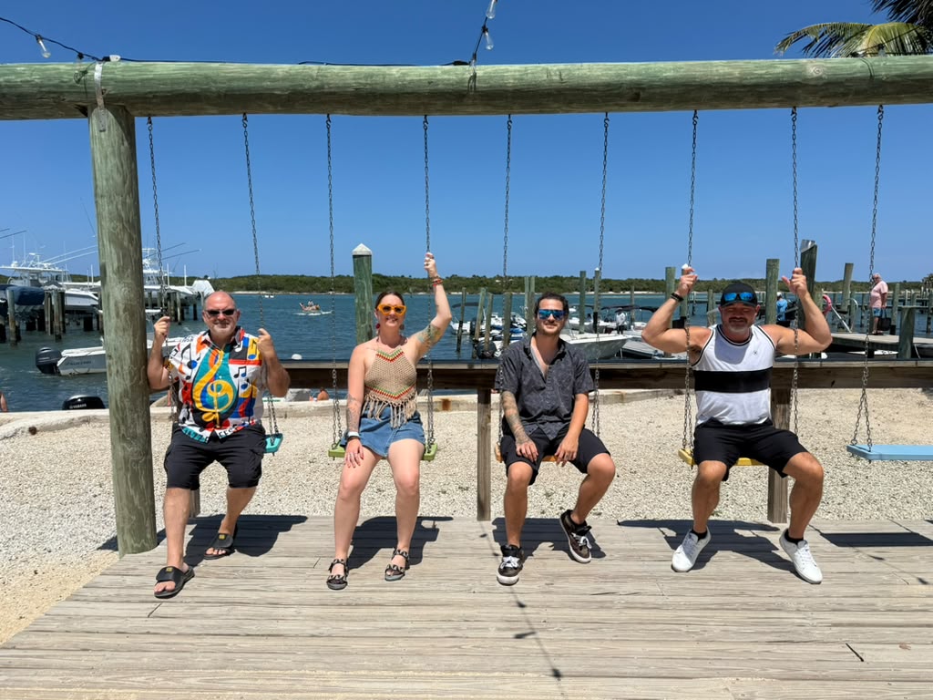 The full Mad Mellow band together on dockside swings