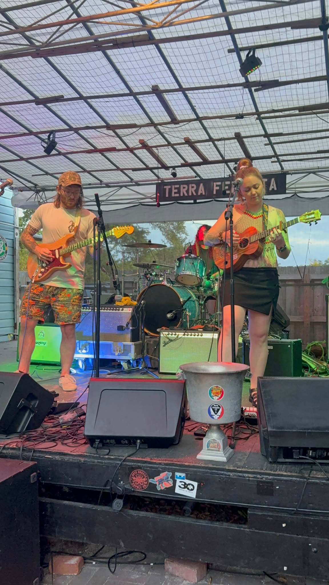 Mad Mellow’s guitarist and singer sharing a song on stage at Terra Fermata