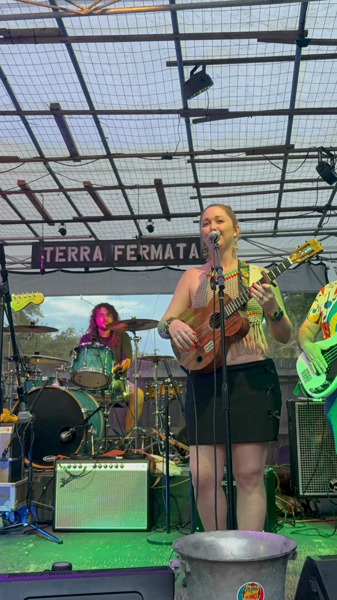 The whole Mad Mellow band on stage at Terra Fermata — singer up front with the drummer and bassist behind