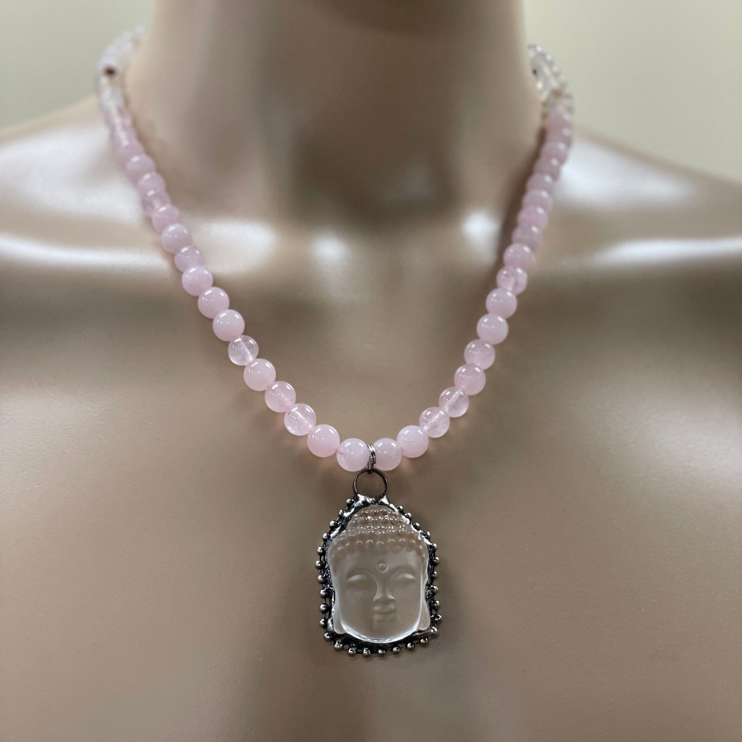 22.5” Stainless Steele Inlayed Hand Carved Clear Quartz Buddha Head Necklace Adorned With 8mm Rose Quartz & Flower Agate Beads