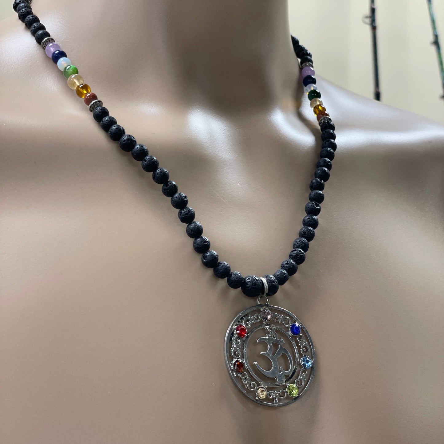 23.5” Stainless Steele Om Chakra Diffuser Necklace Adorned With 6mm Lava Stone Diffuser Beads & Chakra Stones (Amethyst, Lapis Lazuli, Opalite, Green Tigers Eye, Citrine, Amber, & Goldstone)